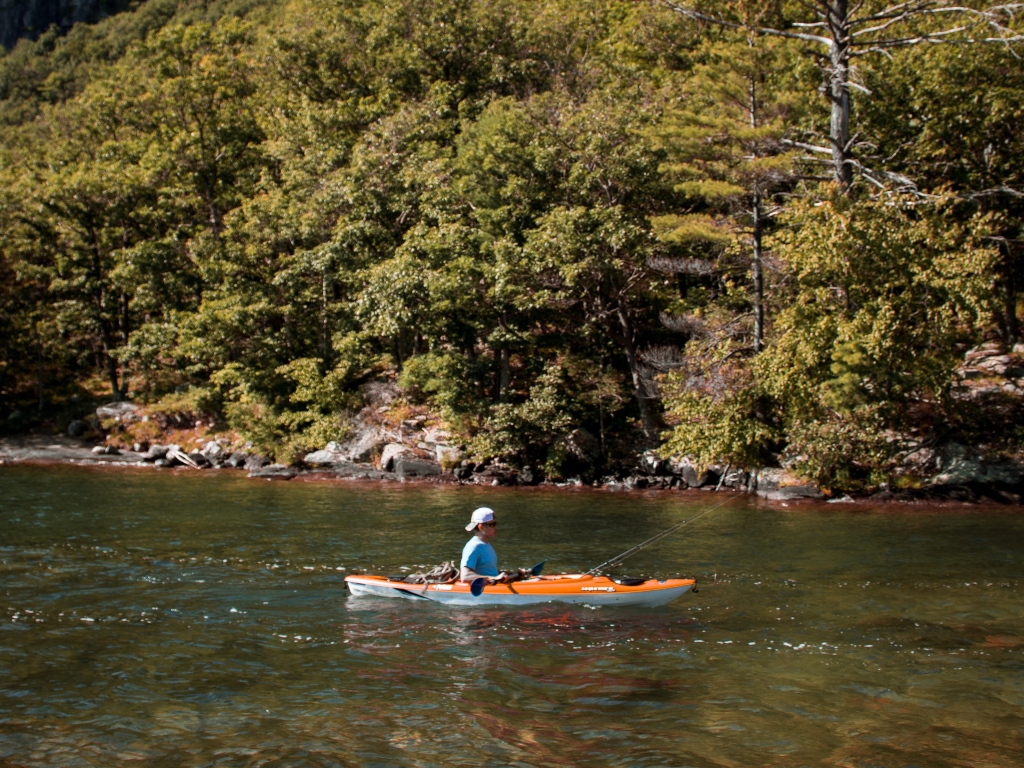 A man kayaking in a river